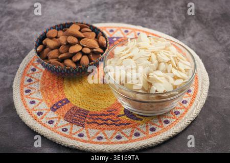Different types of nuts on a colorful mat in a kitchen Stock Photo