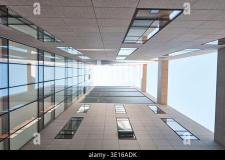 Vertical atrium view looking upward through a contemporary building courtyard. Stock Photo