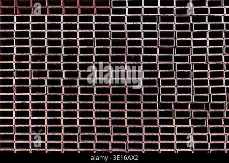 Stacked rectangular hollow sections forming an abstract geometric industrial pattern Stock Photo