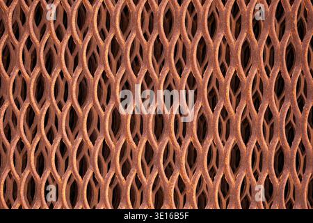 Rusting expanded metal reinforcing old industrial flooring grid pattern texture Stock Photo