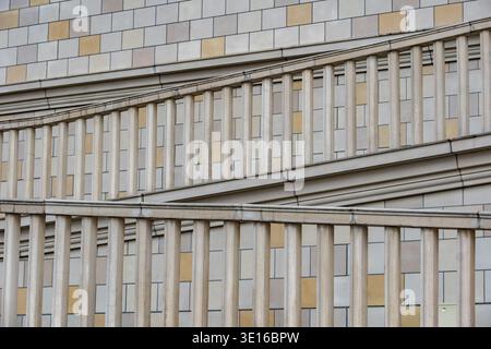 Modern building facade showcasing geometric patterns and architectural balustrade elements Stock Photo
