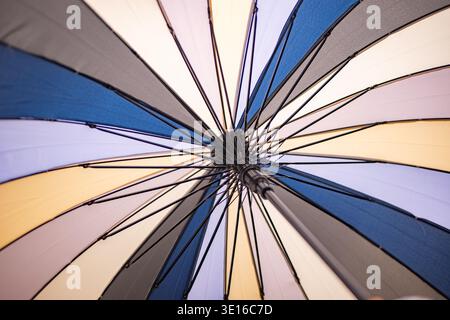 Colorful umbrella canopy creating abstract pattern of lines and geometric shapes Stock Photo