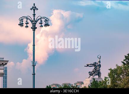 Worker and Kolkhoz Woman monument in Moscow against a colorful sunset sky Stock Photo