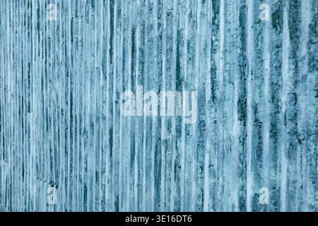 Weathered blue wall texture providing a pattern and background with vertical stripes Stock Photo