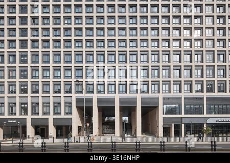 Grid like office facade with repetitive windows and modern detailing. Stock Photo