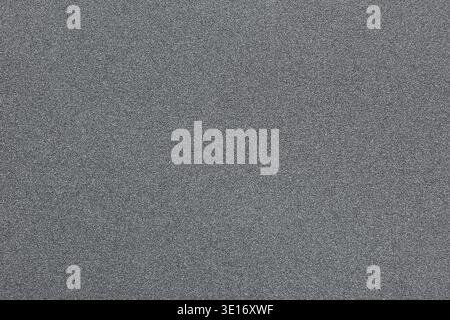 Gray concrete wall showing rough grainy texture as abstract background surface Stock Photo