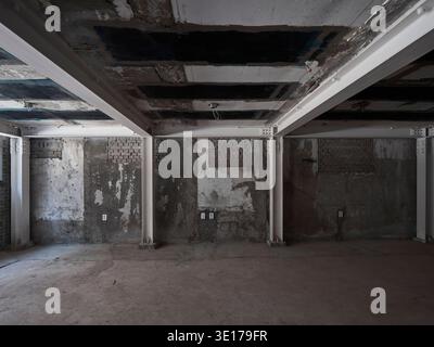 Raw unfinished concrete interior under construction. Stock Photo