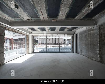 Raw unfinished concrete interior under construction. Stock Photo