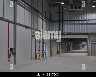 Warehouse service corridor with loading docks. Stock Photo