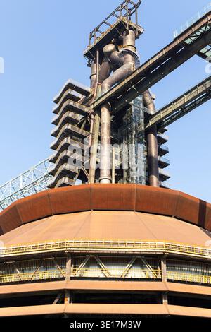 A stunning example of modern industrial architecture showcasing the intricate design of a metallurgical plant. The image highlights sleek metal struct Stock Photo