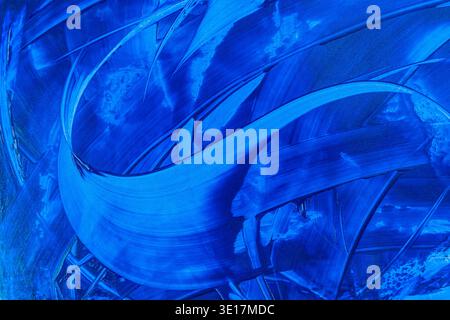 Abstract blue acrylic paint background featuring dynamic brushstrokes. The vivid blue hues create a sense of movement and depth, making it perfect for Stock Photo