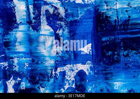 Abstract blue acrylic paint background showcasing dynamic brush strokes and textured patterns. The vibrant hues and intricate details create a captiva Stock Photo