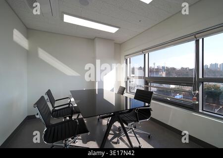 Meeting room with city view and daylight. Stock Photo