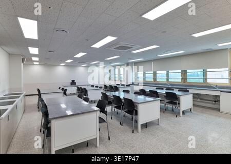 Science classroom with lab tables and blue seating. Stock Photo