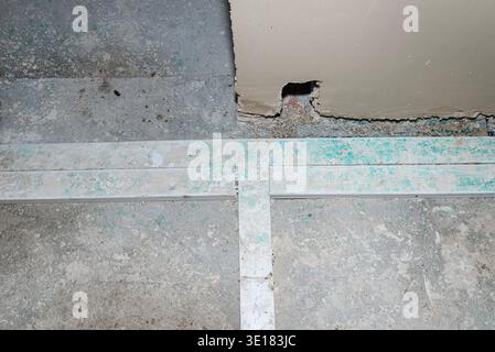 Electrical conduits embedded in concrete floor during house construction Stock Photo