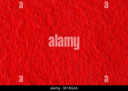Abstract background with red felt texture, velvet fabric. Stock Photo