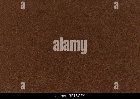 Dark brown paper texture cardboard background. Stock Photo