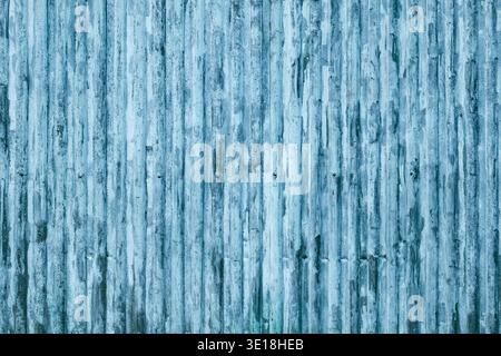 Weathered blue corrugated metal texture with vertical lines and industrial pattern Stock Photo