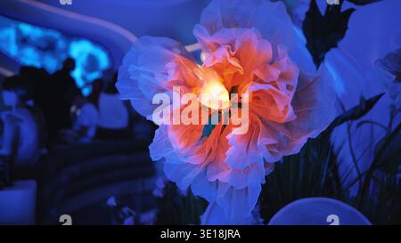 Artificial flowers that open and close at the exhibition. Stock Photo