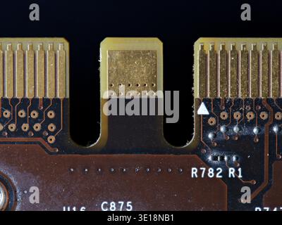 Macro detail of gold-plated SLI connector on a vintage graphics card Stock Photo