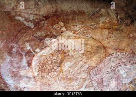 Aboriginal rock art depicts figures of Mimi Spirits on a cave wall ...