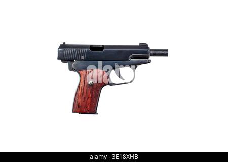 Miniature pistol with an open slide and wooden grip isolated on a solid white background. Stock Photo
