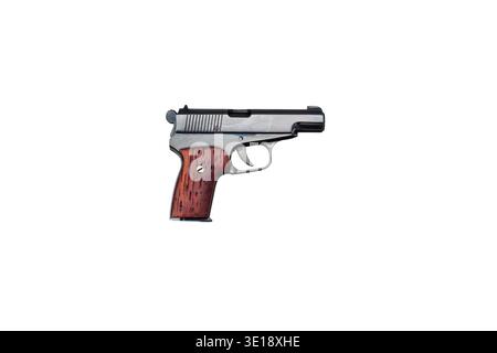 Profile view of a miniature pistol replica with wooden grip isolated on white. Stock Photo