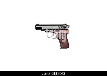 Profile view of a miniature pistol replica with wooden grip isolated on white. Stock Photo