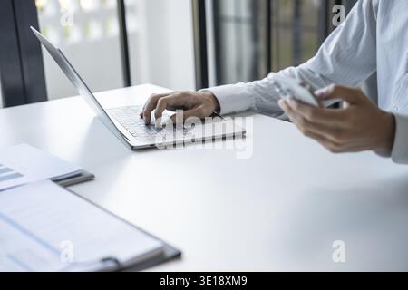 Successful Businessman Using Smartphone During Office Work Stock Photo