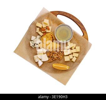 A beautifully arranged platter showcasing various cheeses, nuts, and fruit. This colorful assortment invites sharing and enjoyment, perfect for gather Stock Photo