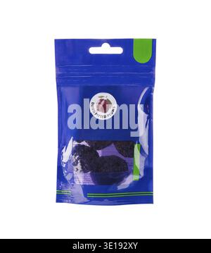 Sealed retail pack of dried pitted plums in a blue plastic bag, isolated on a white background Stock Photo