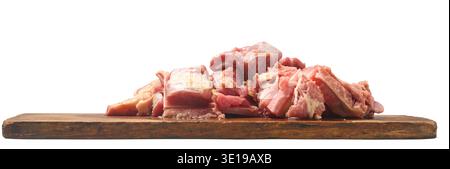 pile of raw red beef meat chunks on wooden board isolated white background, fresh culinary ingredient, side view Stock Photo