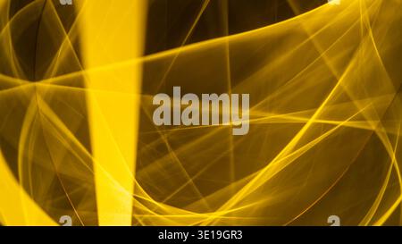 Golden abstract lines form dynamic, glowing light streaks, creating a modern and energetic visual background perfect for technology, motion, or cosmic Stock Photo
