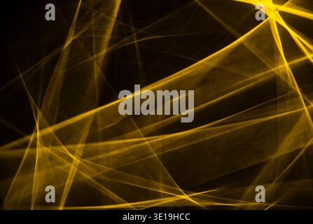 Golden energy streams and glowing light trails flow across a dark background, forming dynamic, fluid patterns and vibrant, futuristic textures suggest Stock Photo