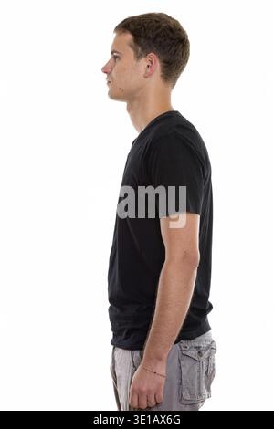 Profile view of young man standing Stock Photo
