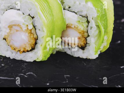 Vegetarian sushi roll with avocado and philadelphia cheese with shrimp Stock Photo