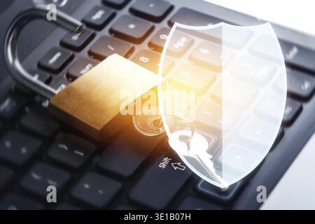 Padlock and laptop computer with Shield symbol. Concepts of information privacy and cyber security Stock Photo
