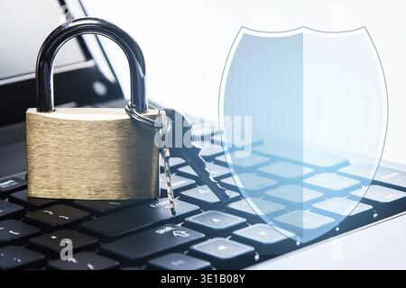 Padlock on a laptop keyboard. Concept of internet security Stock Photo
