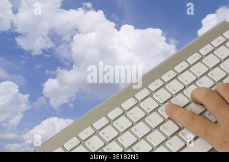 Cloud computing concept - keyboard over cloudscape Stock Photo