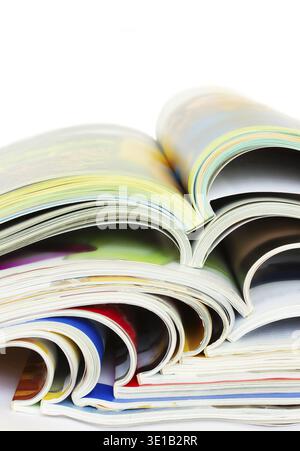 Pile of many open glossy paper magazines Stock Photo