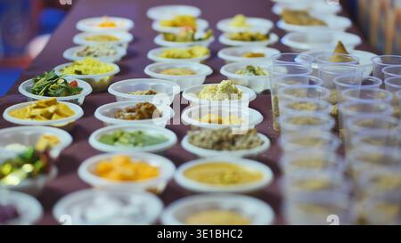 Indian devotees sharing food during Ganesh Chaturthi festival celebration Stock Photo
