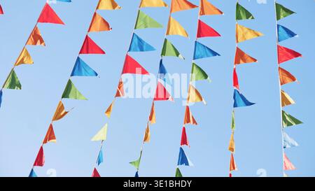 Colorful triangular flags waving in the wind in Moscow Stock Photo