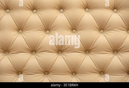 Beige tufted upholstery texture creating a luxurious chesterfield furniture background Stock Photo