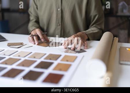 Architecture interior Man Creative project plan designer home and Choose interior materials Stock Photo