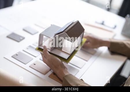Architecture interior Man Creative project plan designer home and Choose interior materials Stock Photo