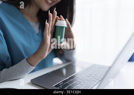 Asian woman Doctor or Pharmacist Providing Online Medication Consultation Stock Photo