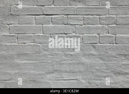 Grey wall, texture, background. The building wall, painted with grey whiting paint. Plastered bumpy surface. Gray brick wall in retro old-style color Stock Photo