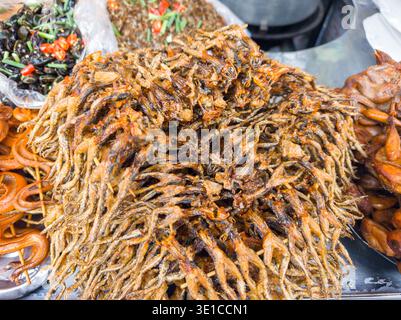 fried anchovies on street food stall, Phnom Penh, Cambodia Stock Photo