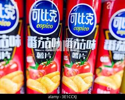 Copico Tomato Flavor Potato Chips, a snack product typically packaged in a canister on a supermarket shelf in Cambodia Stock Photo