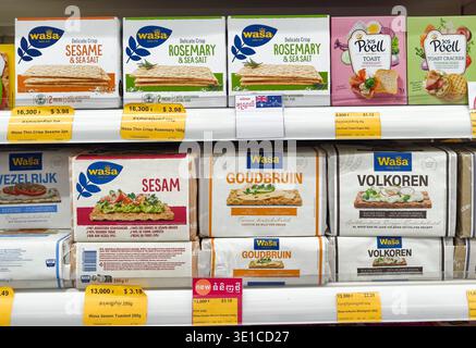 various Wasa crispbread and Poell toast products on a store shelf in a supermarket in Cambodia Stock Photo